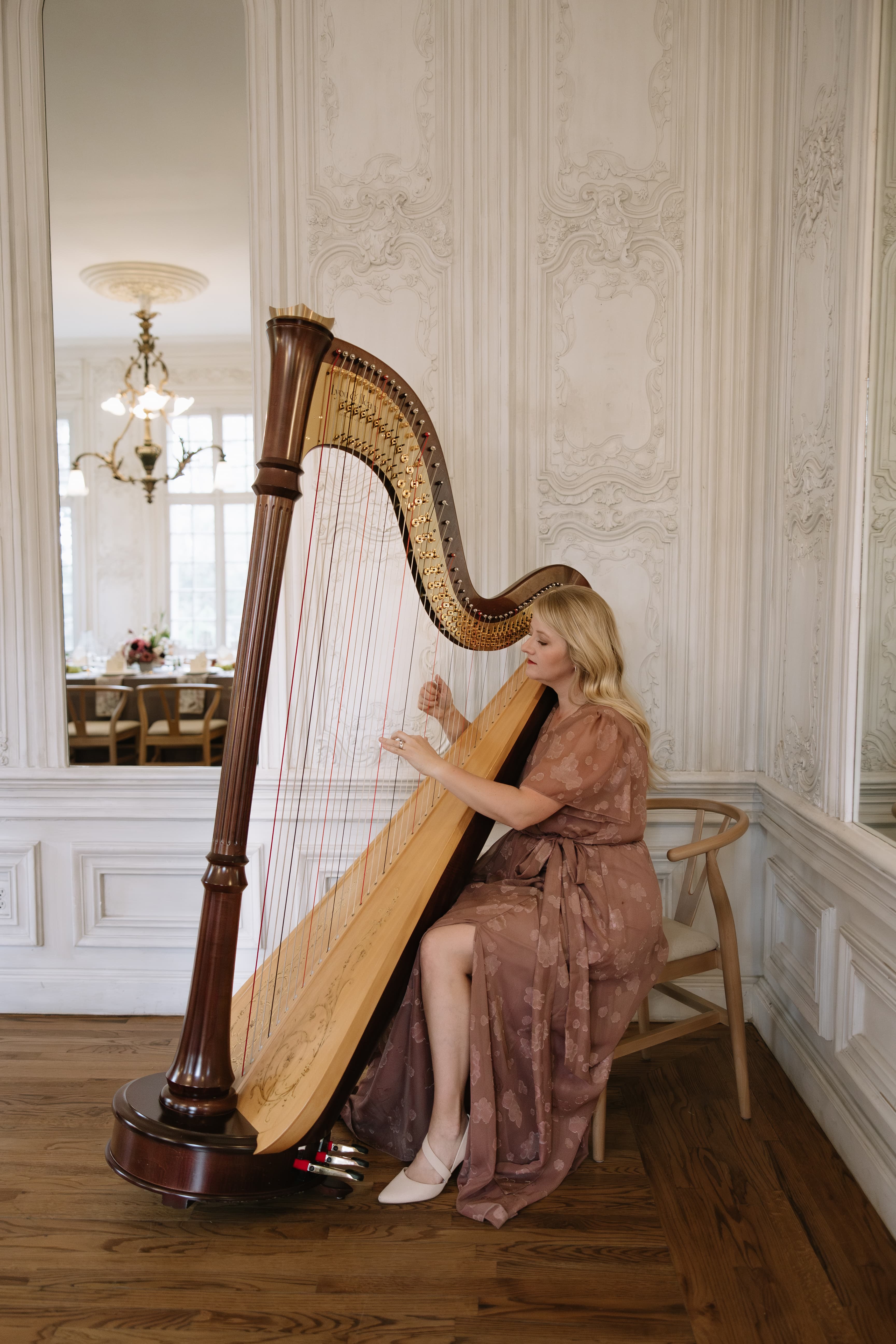 Laura Neil playing pedal harp at a Utah wedding ceremony